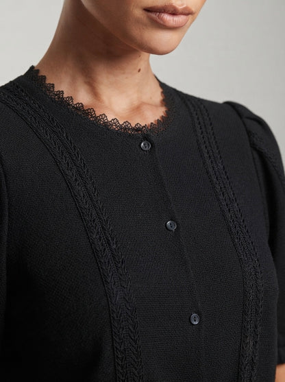 Elegantna crna vestica s puf rukavima | L